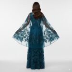 An enchanting petrol-colored tulle evening gown, adorned with floral embroidery An enchanting petrol-colored tulle evening gown, adorned with floral embroidery